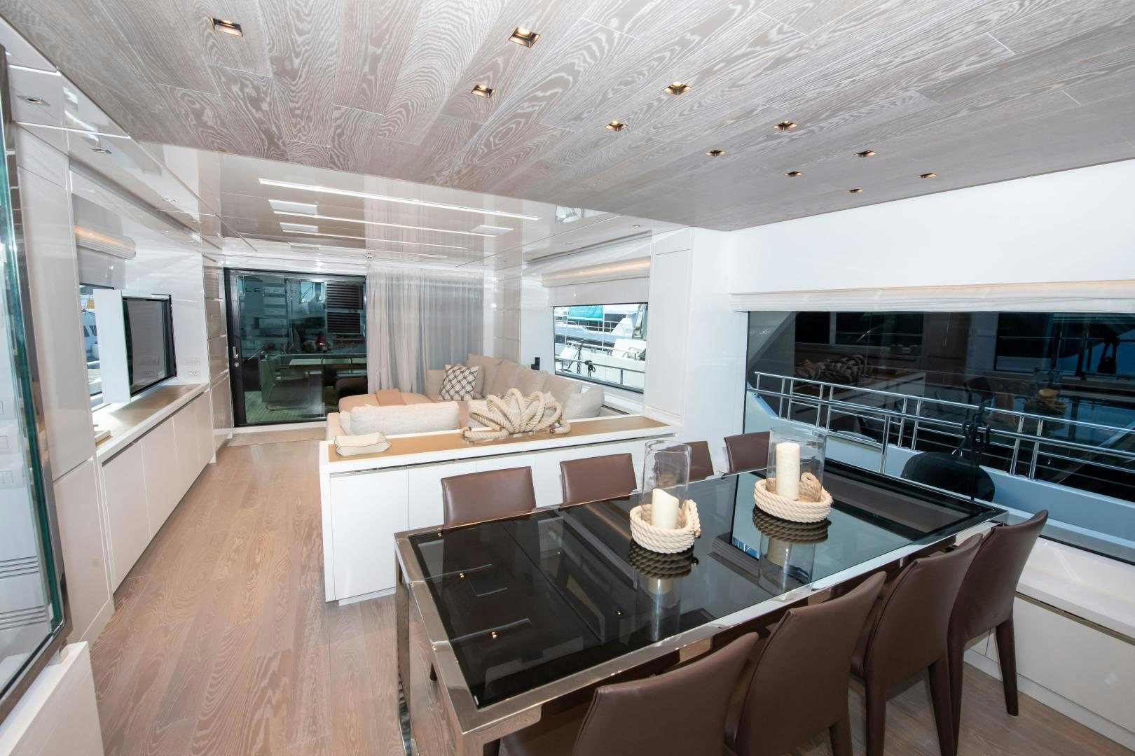 a large living room with a large table and chairs aboard MARAVI Yacht for Sale