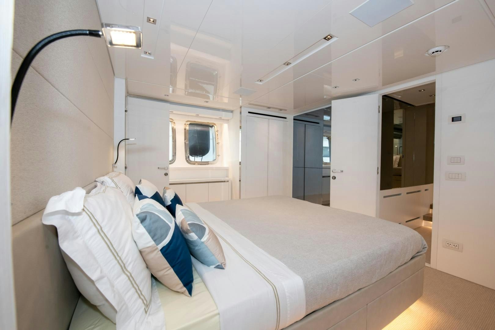 a room with beds and a television aboard MARAVI Yacht for Sale
