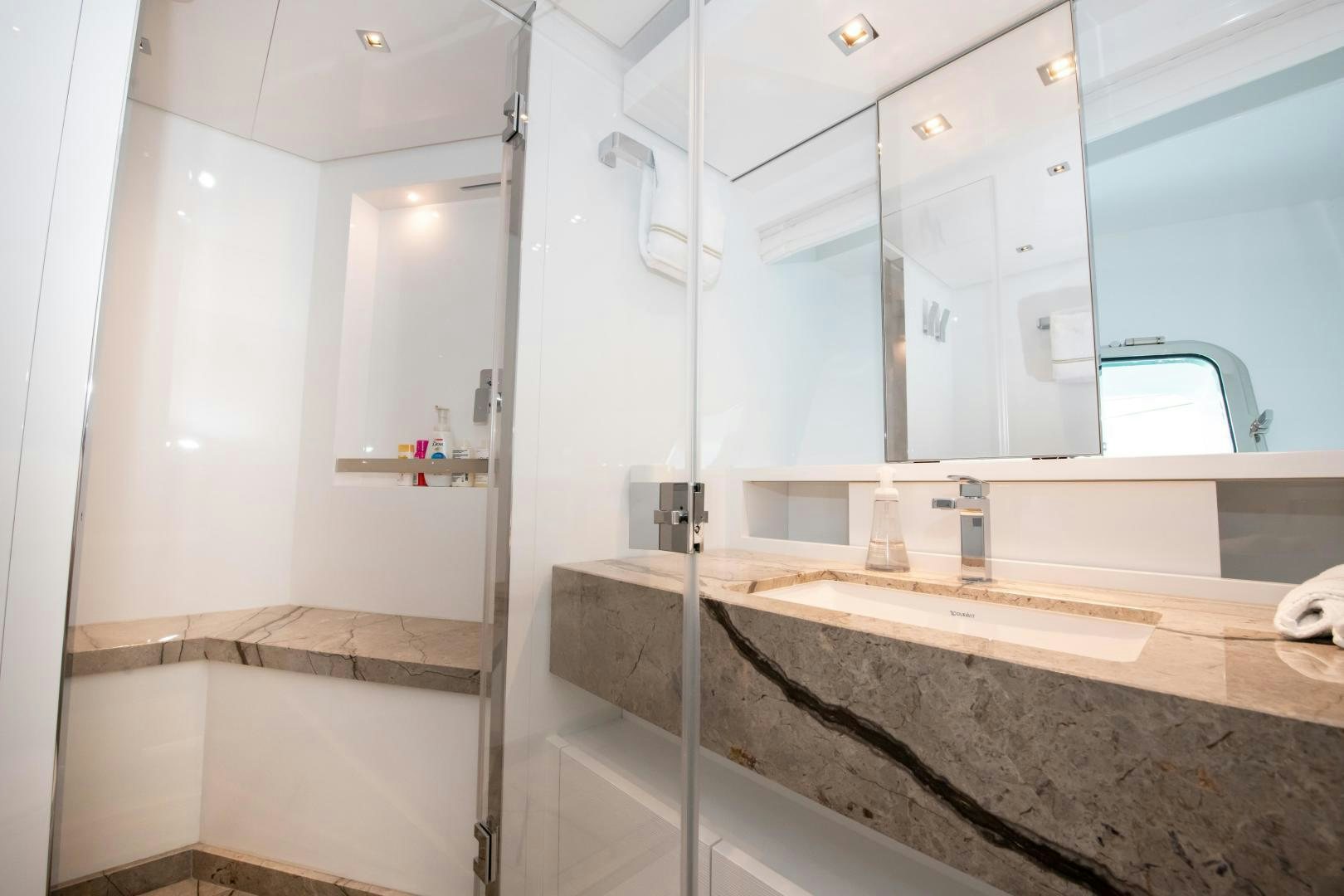 a bathroom with a glass shower aboard MARAVI Yacht for Sale