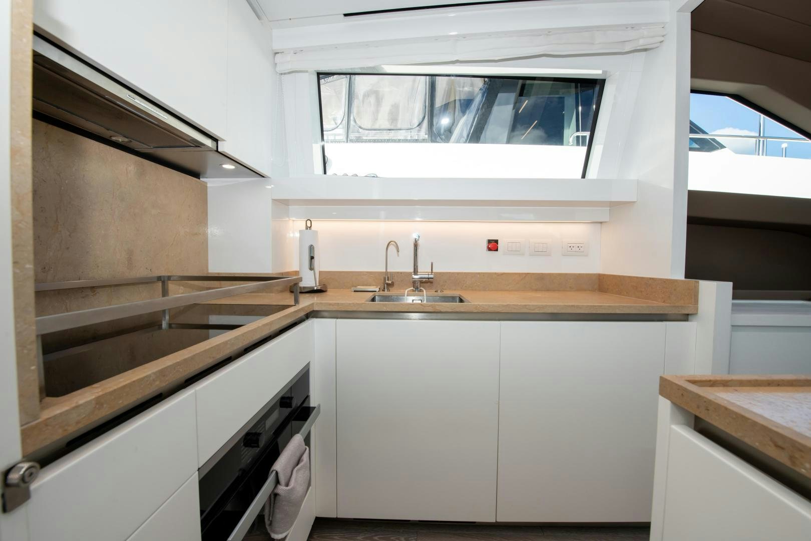 a kitchen with a sink and a microwave aboard MARAVI Yacht for Sale