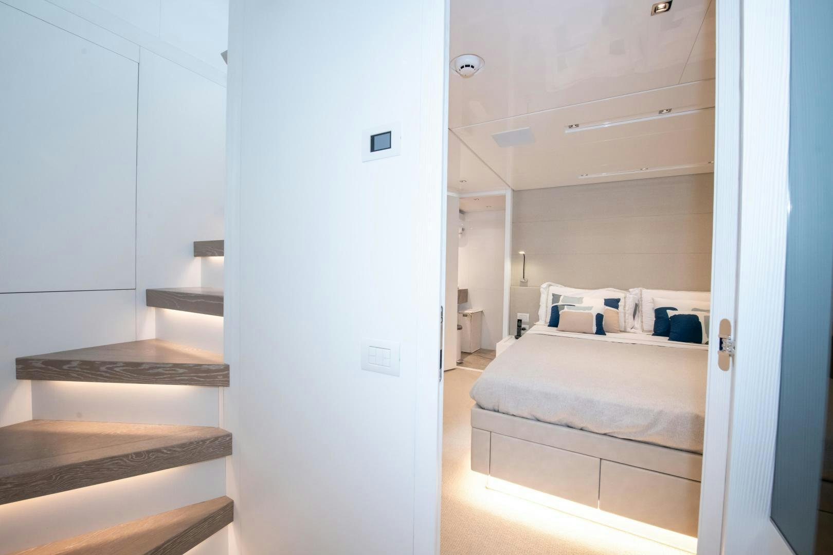 a room with a bed and a closet aboard MARAVI Yacht for Sale