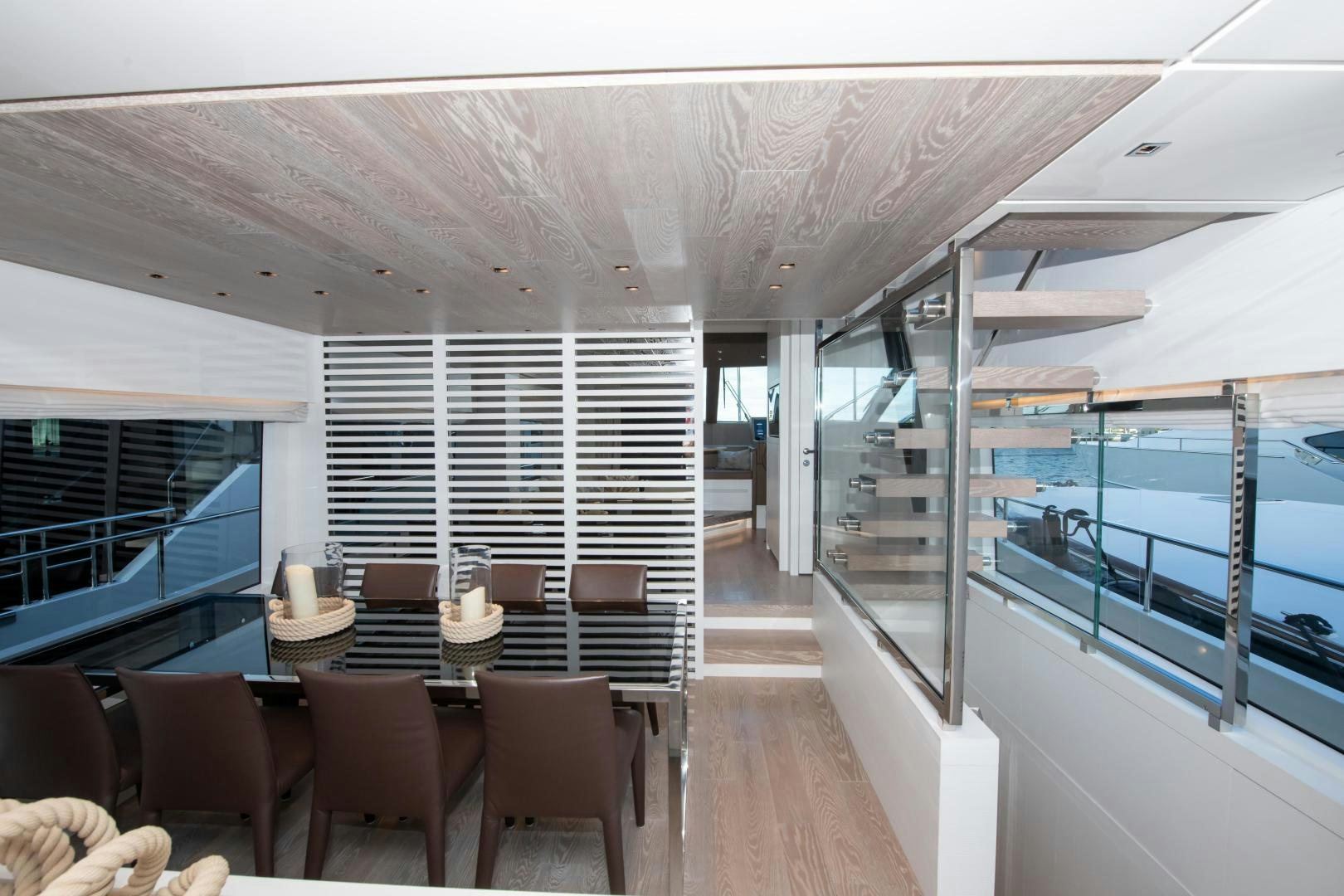 a room with a table chairs and a large window aboard MARAVI Yacht for Sale