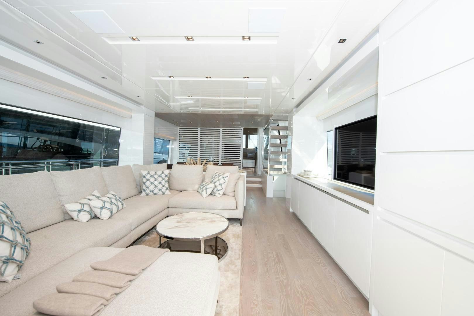 a living room with a couch and a table aboard MARAVI Yacht for Sale