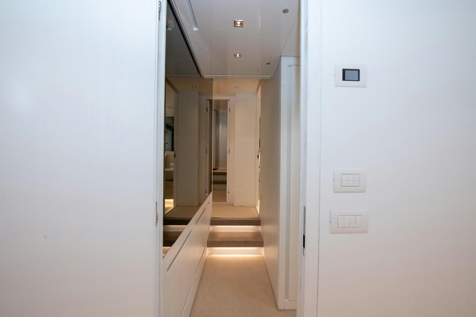 a hallway with white walls aboard MARAVI Yacht for Sale