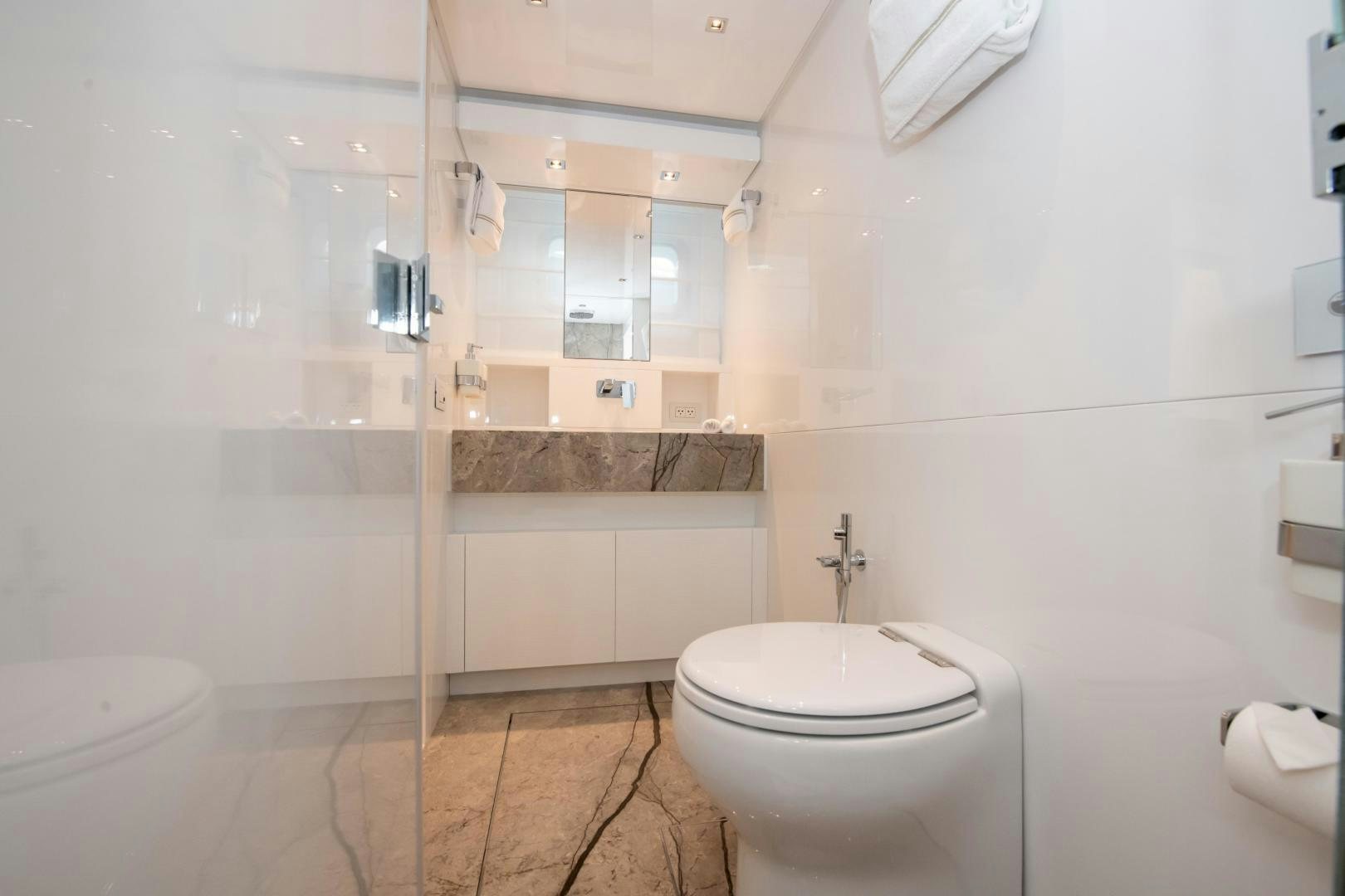 a bathroom with a toilet and sink aboard MARAVI Yacht for Sale