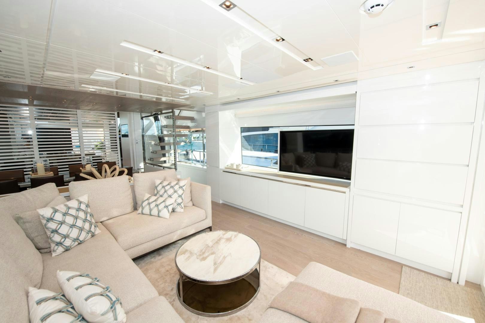 a living room with a couch and a television aboard MARAVI Yacht for Sale