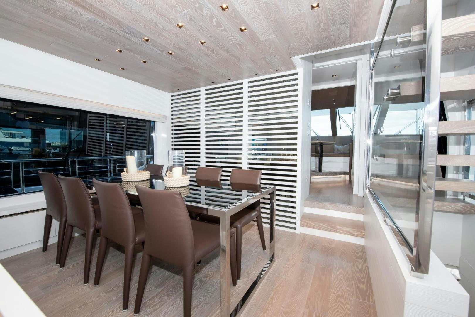 a room with a table chairs and a window aboard MARAVI Yacht for Sale