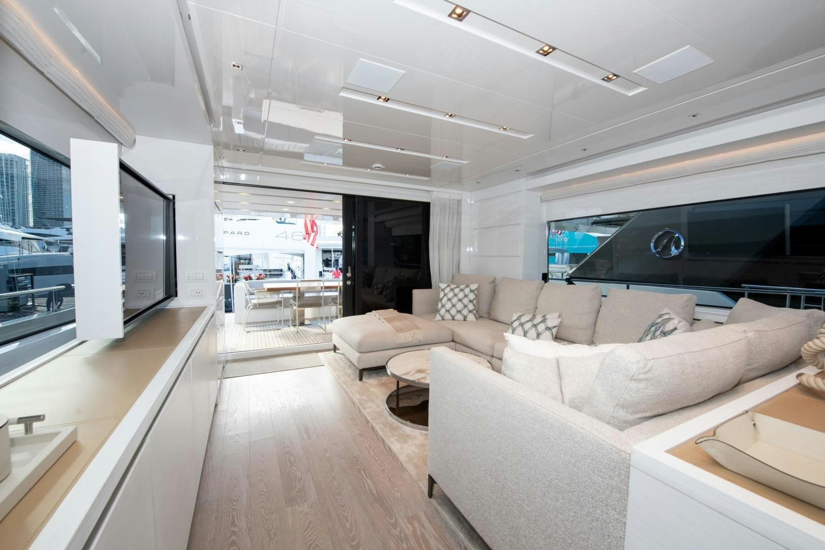 a living room with a large window aboard MARAVI Yacht for Sale