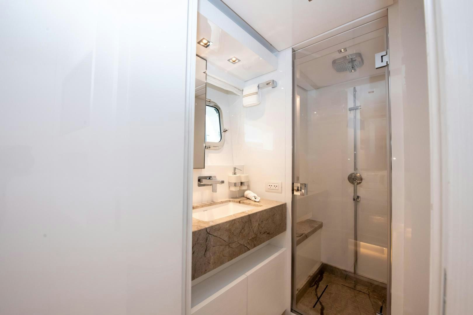 a bathroom with a glass shower aboard MARAVI Yacht for Sale