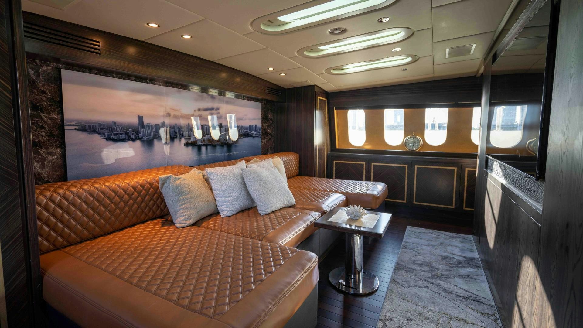 a room with a couch and a table aboard ENCORE Yacht for Sale