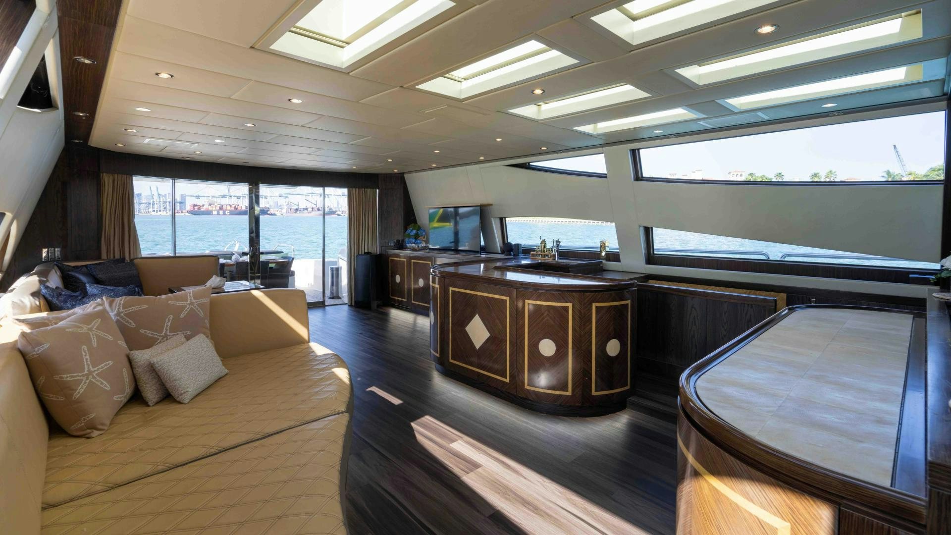 a room with a bed and a desk aboard ENCORE Yacht for Sale