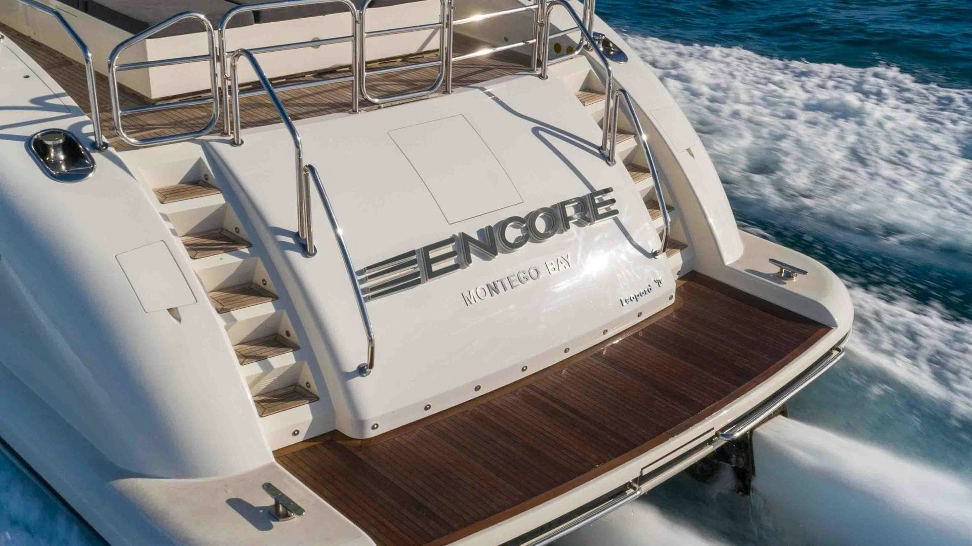 a white boat on a deck aboard ENCORE Yacht for Sale