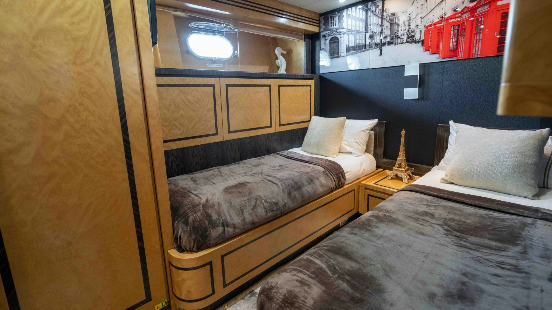 a room with two beds aboard ENCORE Yacht for Sale