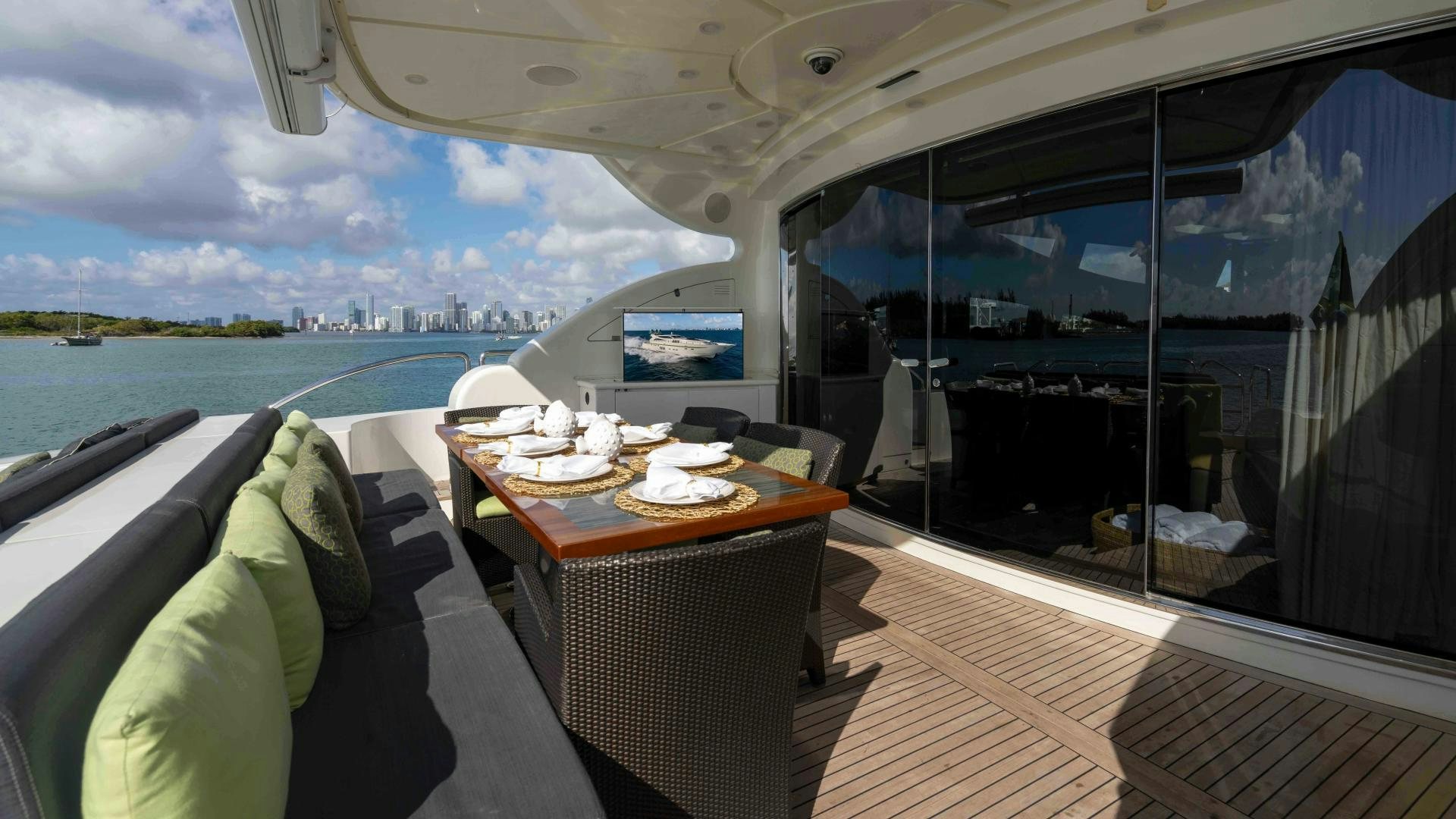 a boat with a table and chairs aboard ENCORE Yacht for Sale