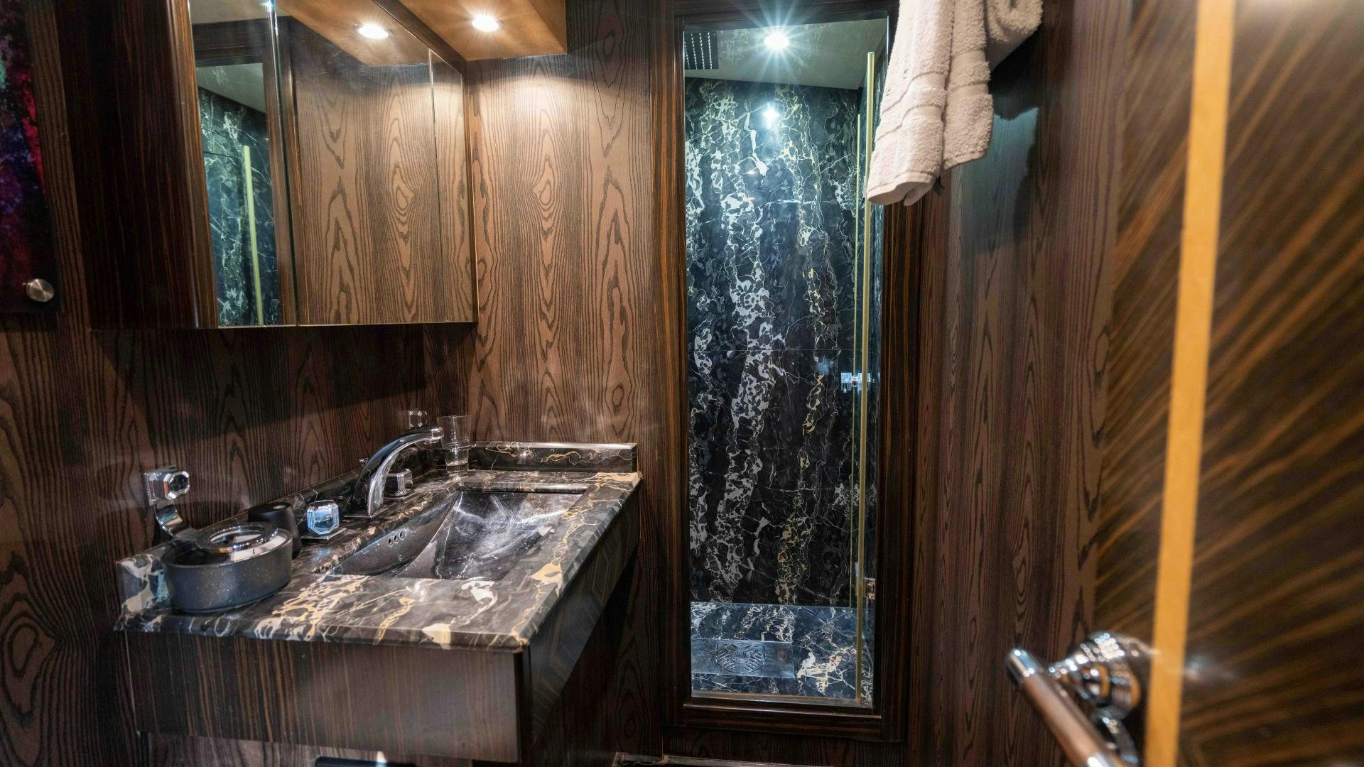 a kitchen with wooden walls aboard ENCORE Yacht for Sale