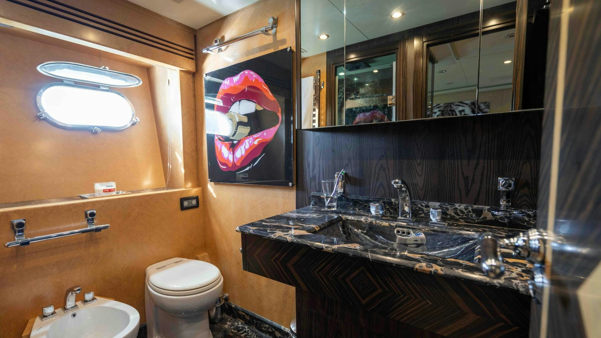 a bathroom with a large mirror aboard ENCORE Yacht for Sale