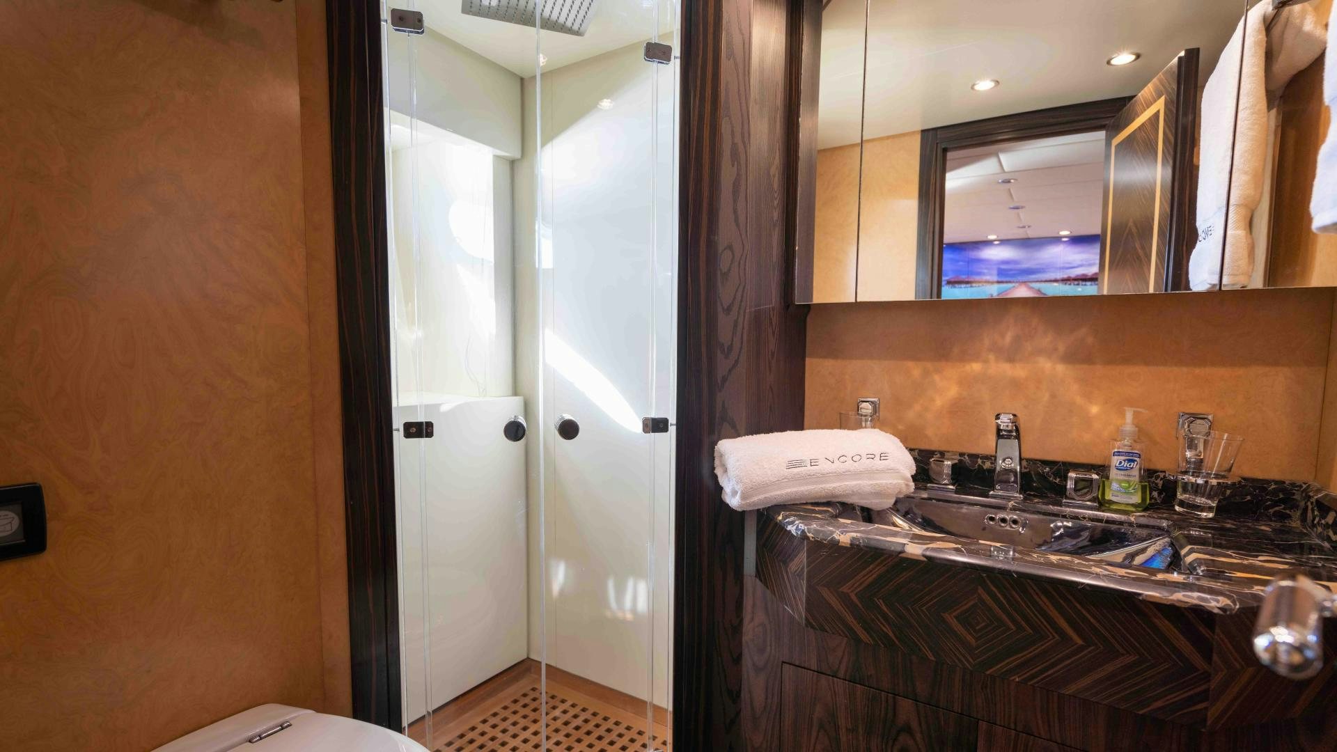 a bathroom with a sink and a mirror aboard ENCORE Yacht for Sale