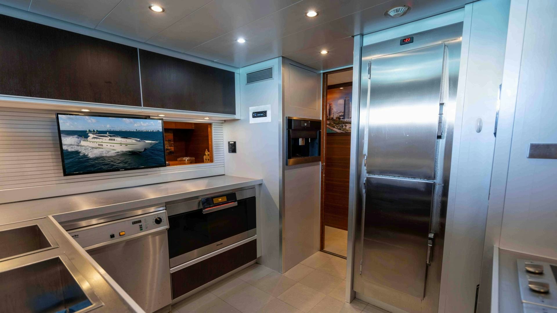 a kitchen with a large glass door aboard ENCORE Yacht for Sale
