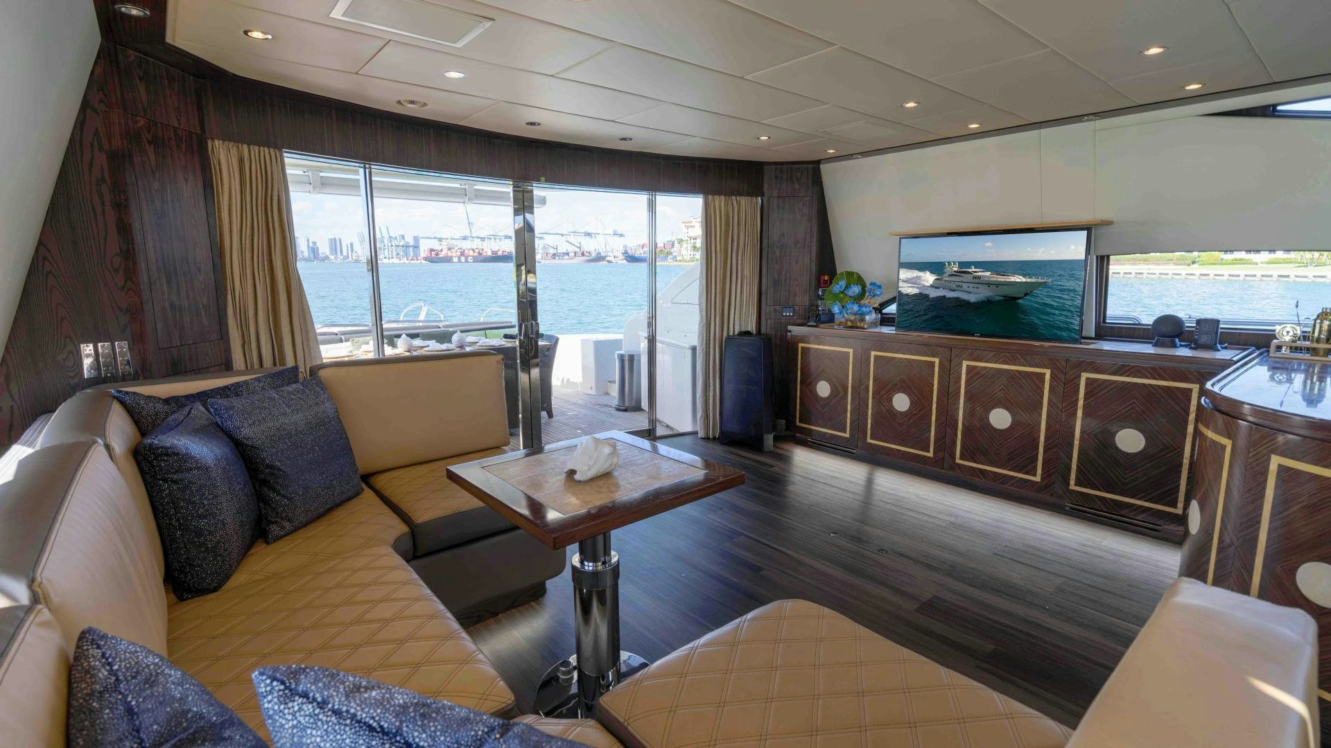 a living room with a large window aboard ENCORE Yacht for Sale