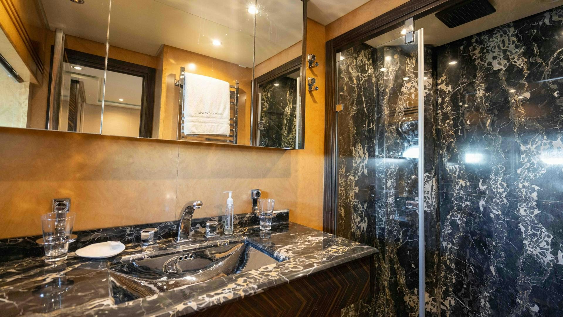 a bathroom with a large countertop aboard ENCORE Yacht for Sale