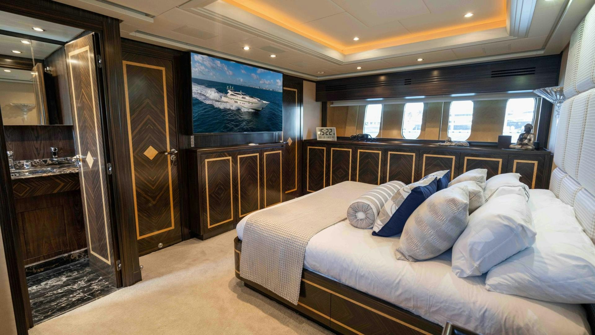 a bed in a room aboard ENCORE Yacht for Sale