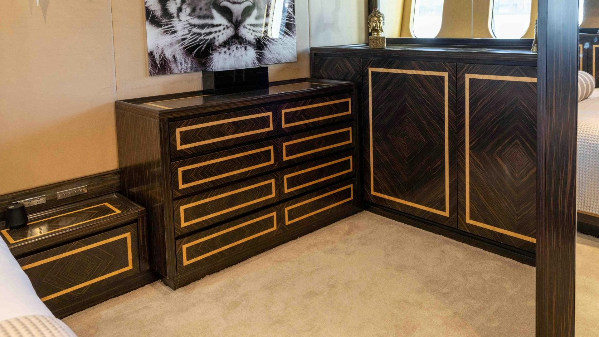 a room with a cabinet and a television aboard ENCORE Yacht for Sale