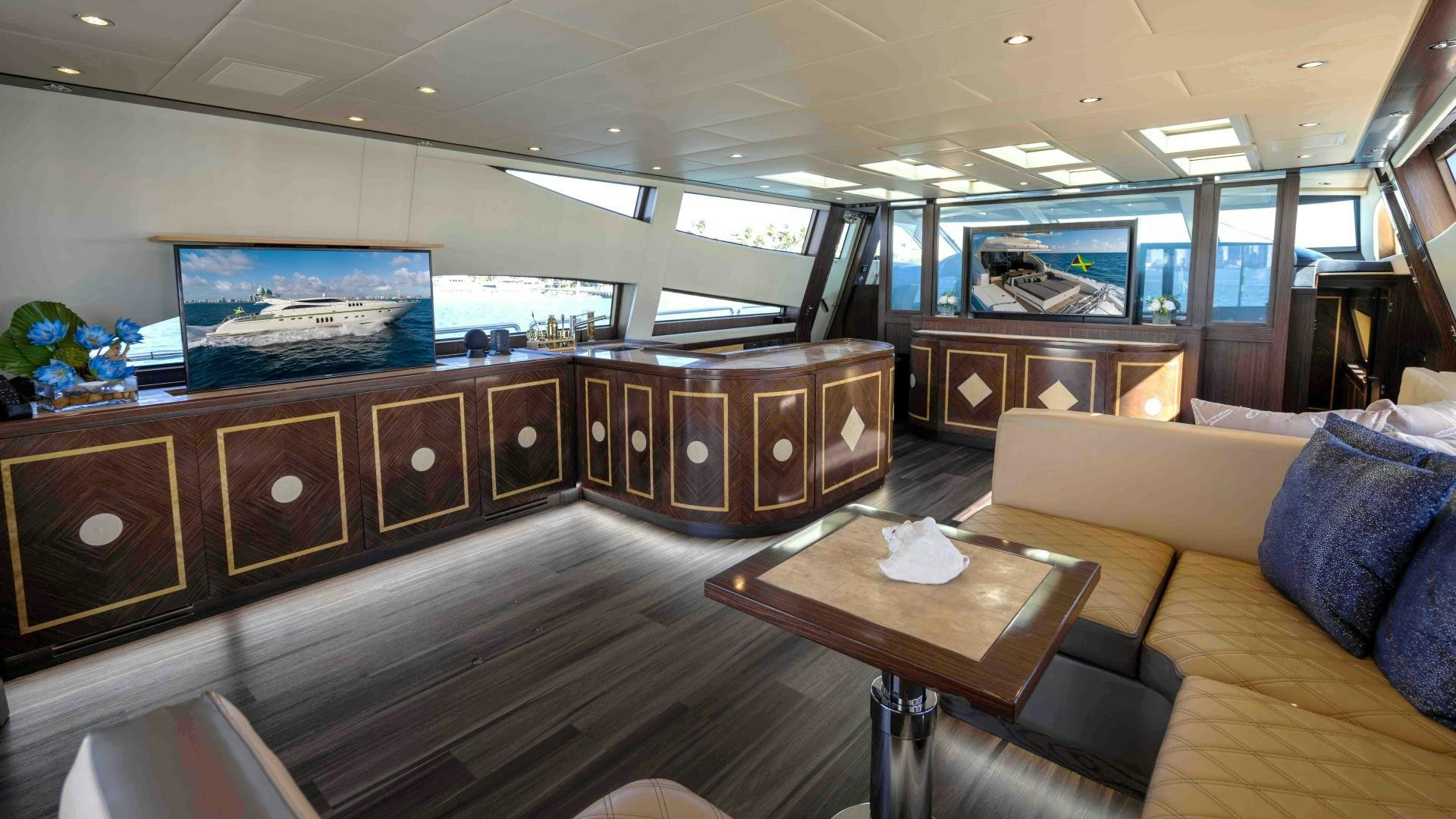 a room with a couch and a table aboard ENCORE Yacht for Sale