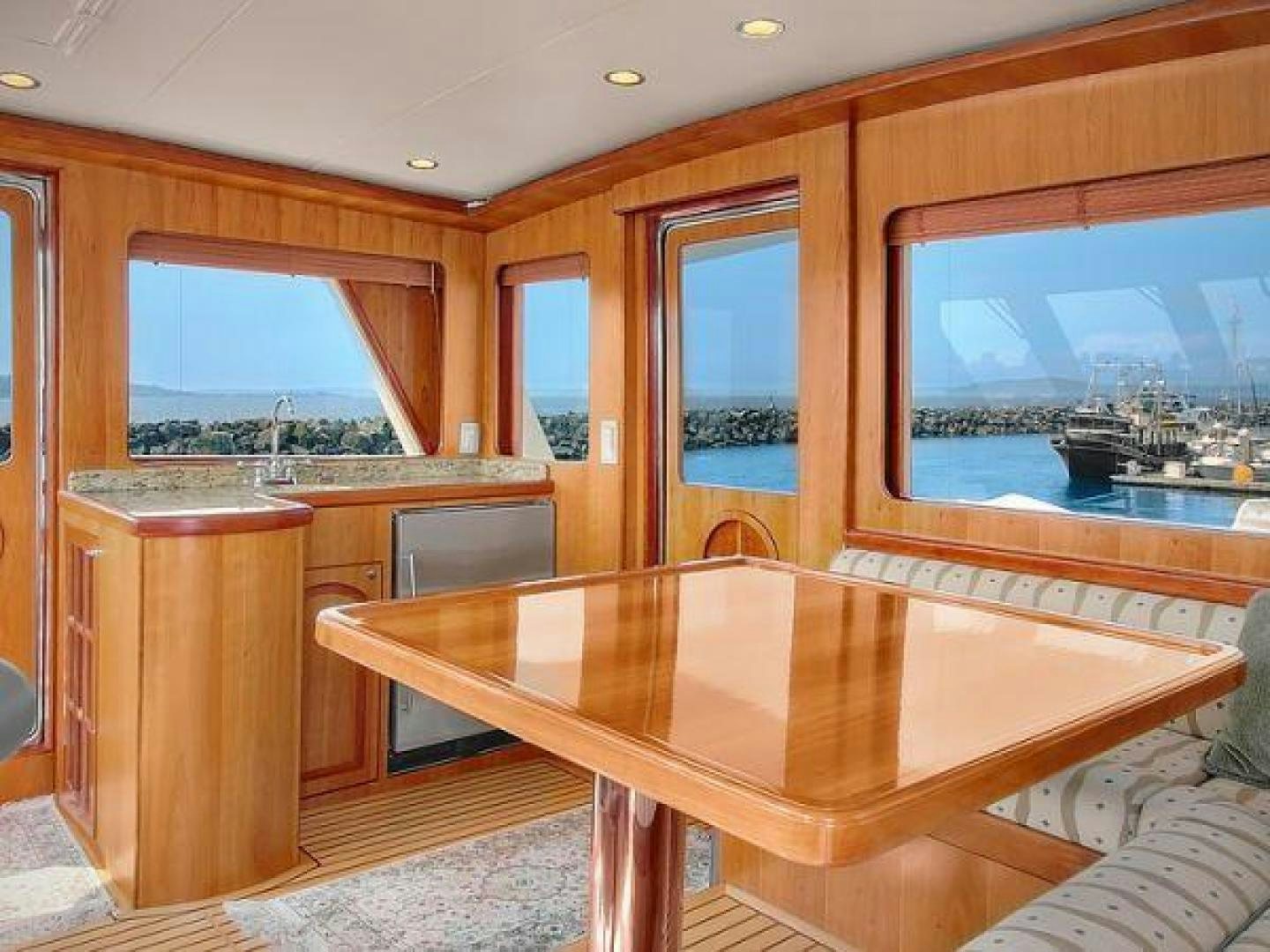 a room with a table and chairs aboard FOLIE DEUX Yacht for Sale
