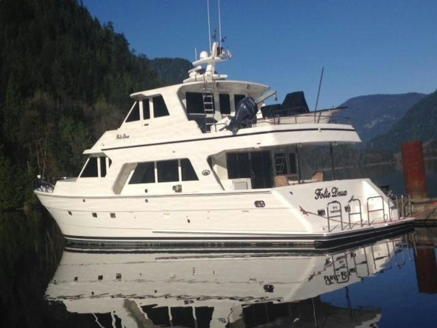 a white boat on water aboard FOLIE DEUX Yacht for Sale