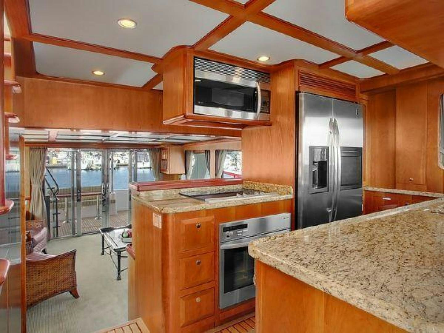 a kitchen with a large island aboard FOLIE DEUX Yacht for Sale