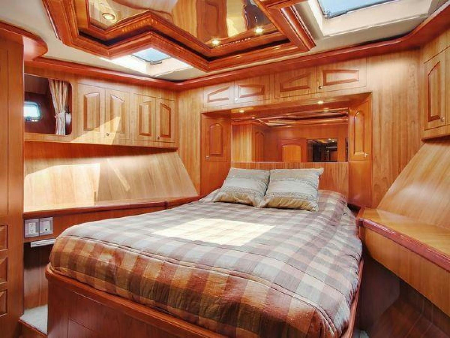 a bed in a room aboard FOLIE DEUX Yacht for Sale