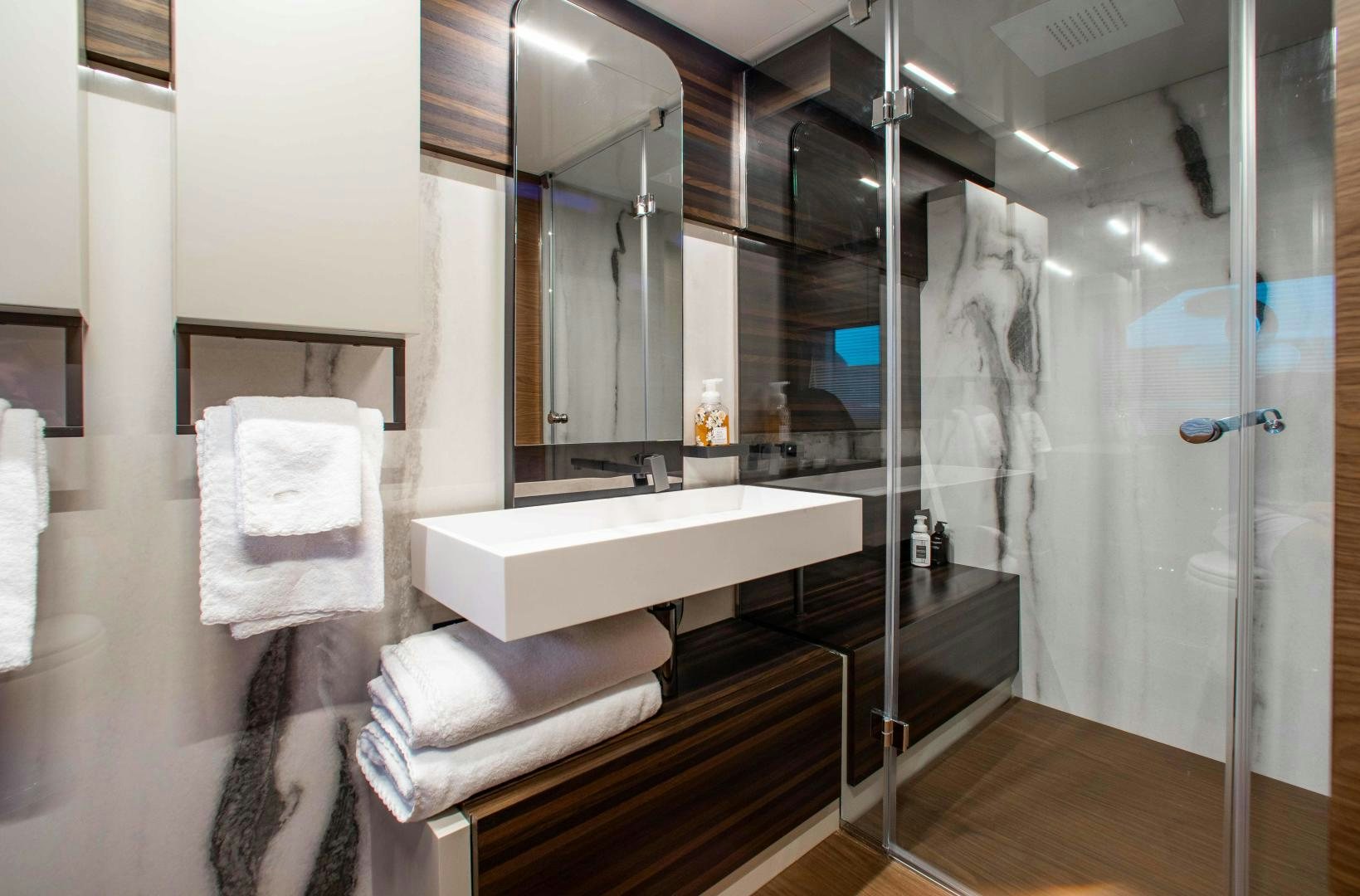 a bathroom with a large mirror aboard OUR TRADE Yacht for Sale