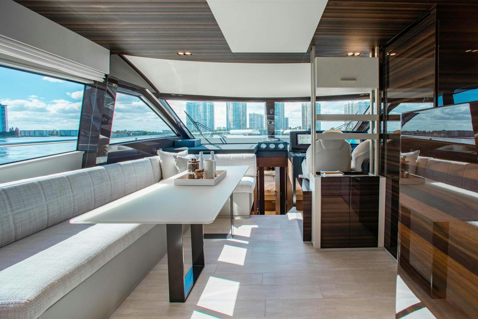 a boat with a table and chairs aboard OUR TRADE Yacht for Sale