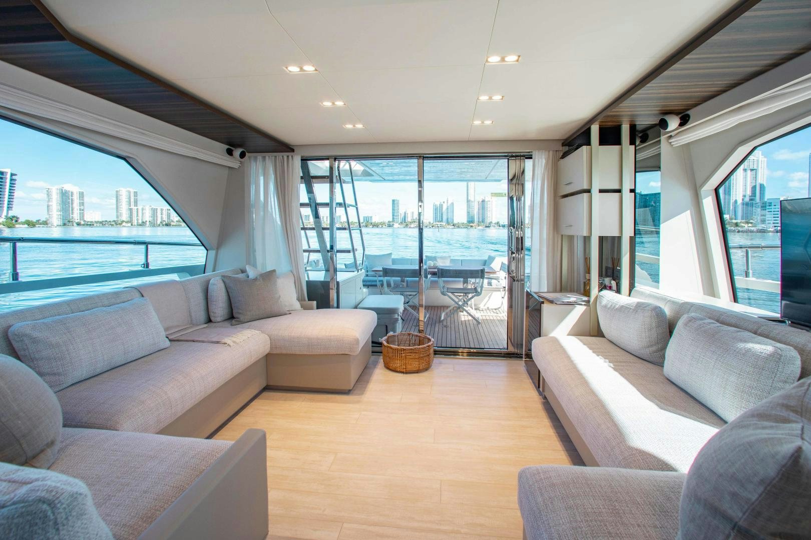 a living room with a large window aboard OUR TRADE Yacht for Sale