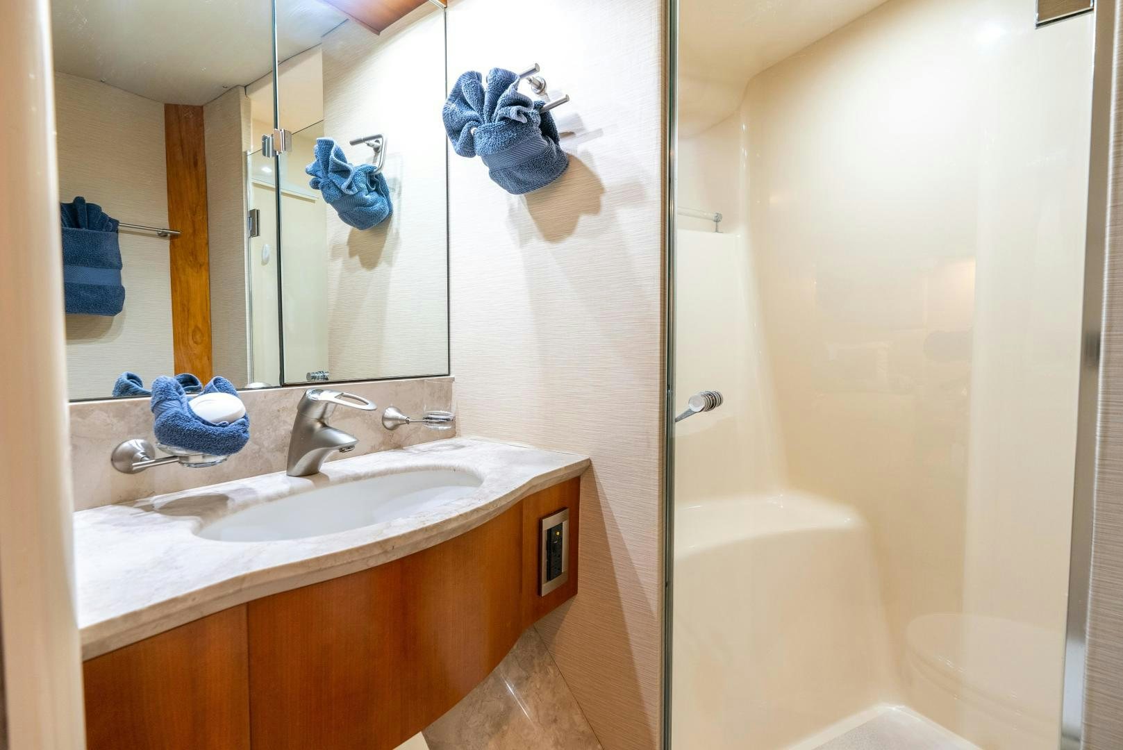 a bathroom with a sink and a mirror aboard STARFIRE Yacht for Sale