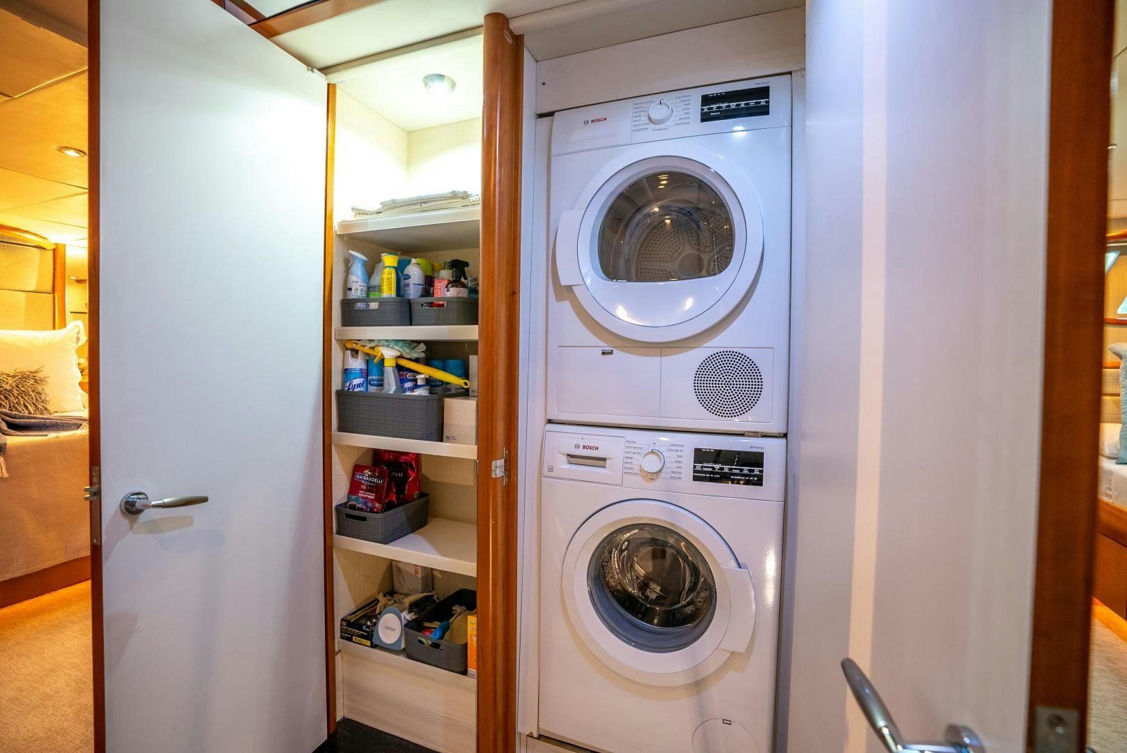 a white washer and dryer in a room aboard STARFIRE Yacht for Sale