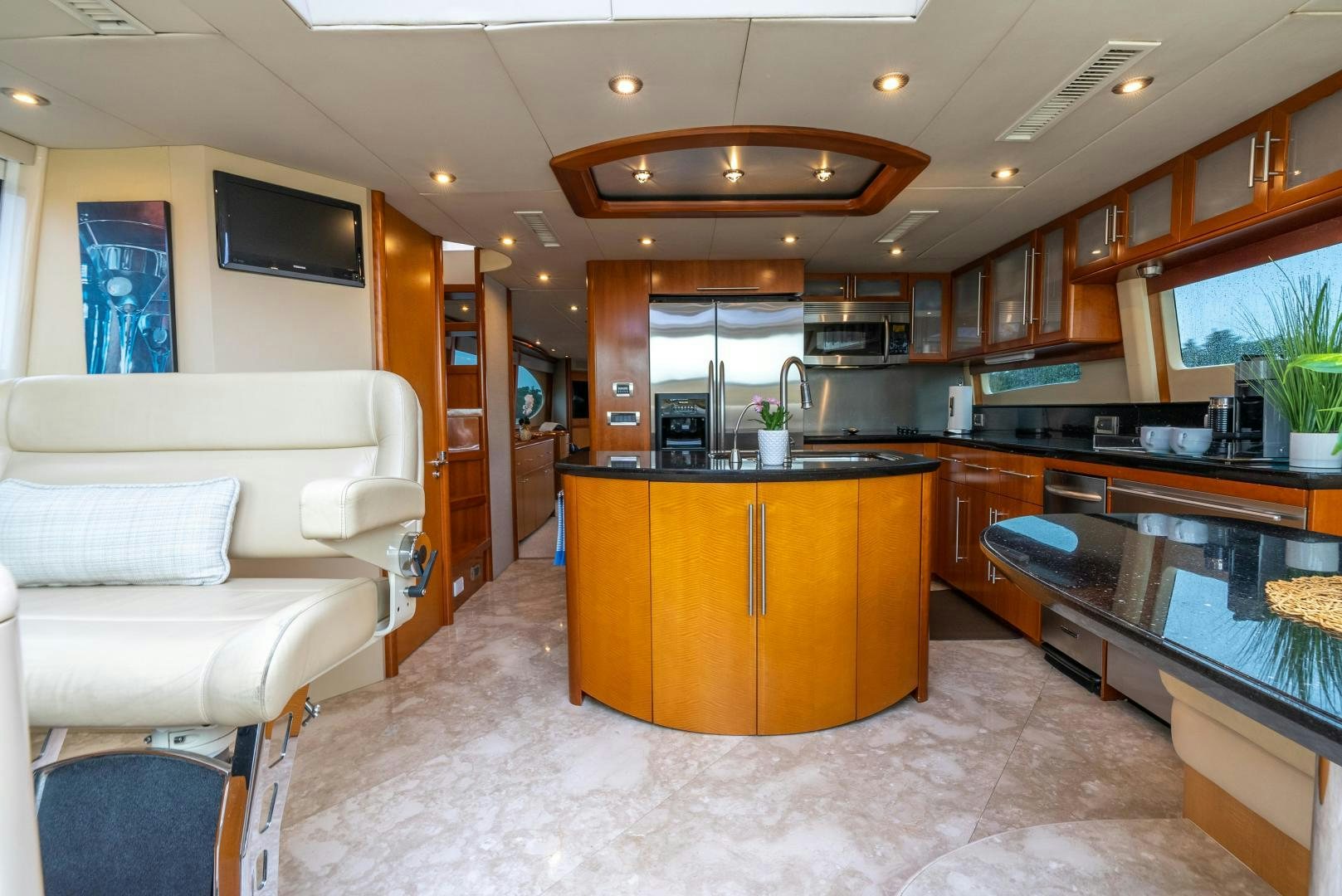 a kitchen with a large island aboard STARFIRE Yacht for Sale