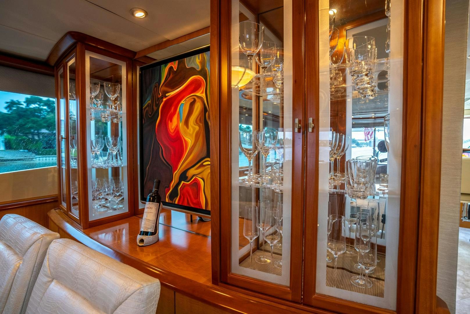 a glass door with a painting on it aboard STARFIRE Yacht for Sale