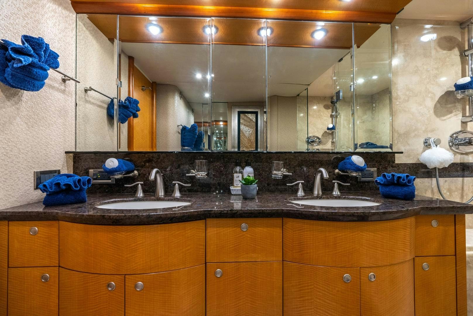 a bathroom with a large mirror aboard STARFIRE Yacht for Sale