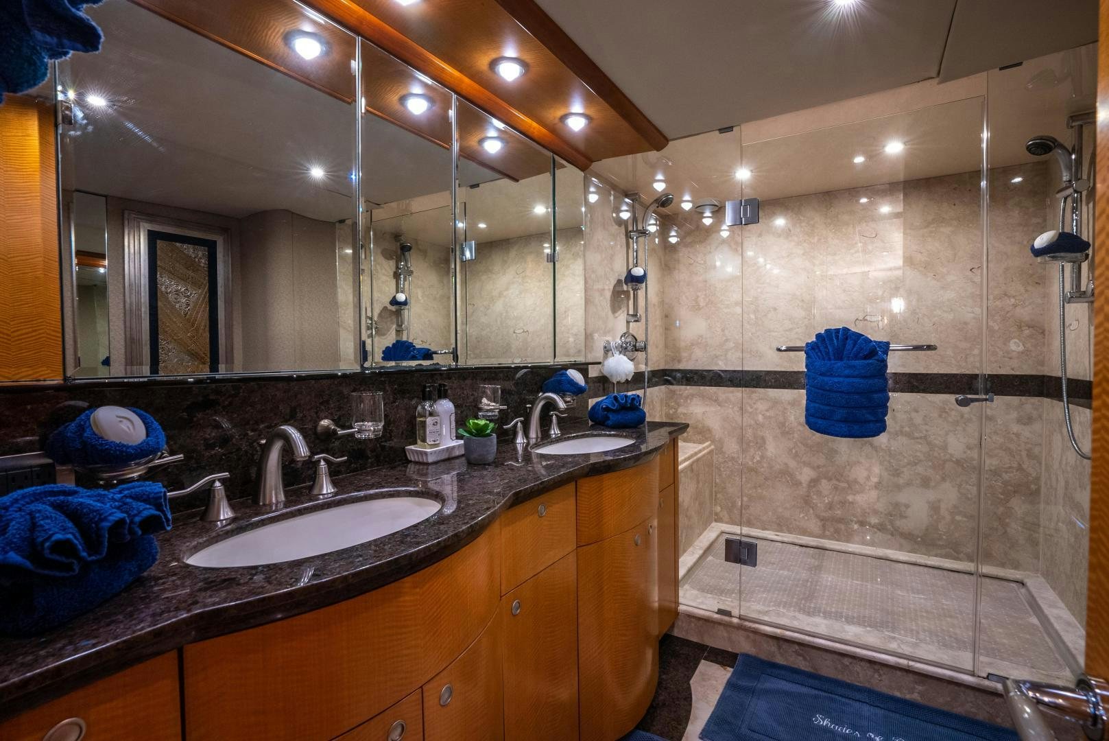 a bathroom with a large mirror aboard STARFIRE Yacht for Sale