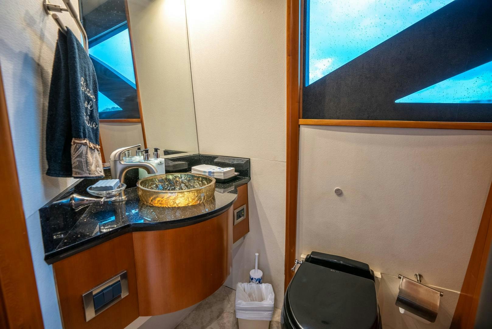 a bathroom with a sink and a mirror aboard STARFIRE Yacht for Sale