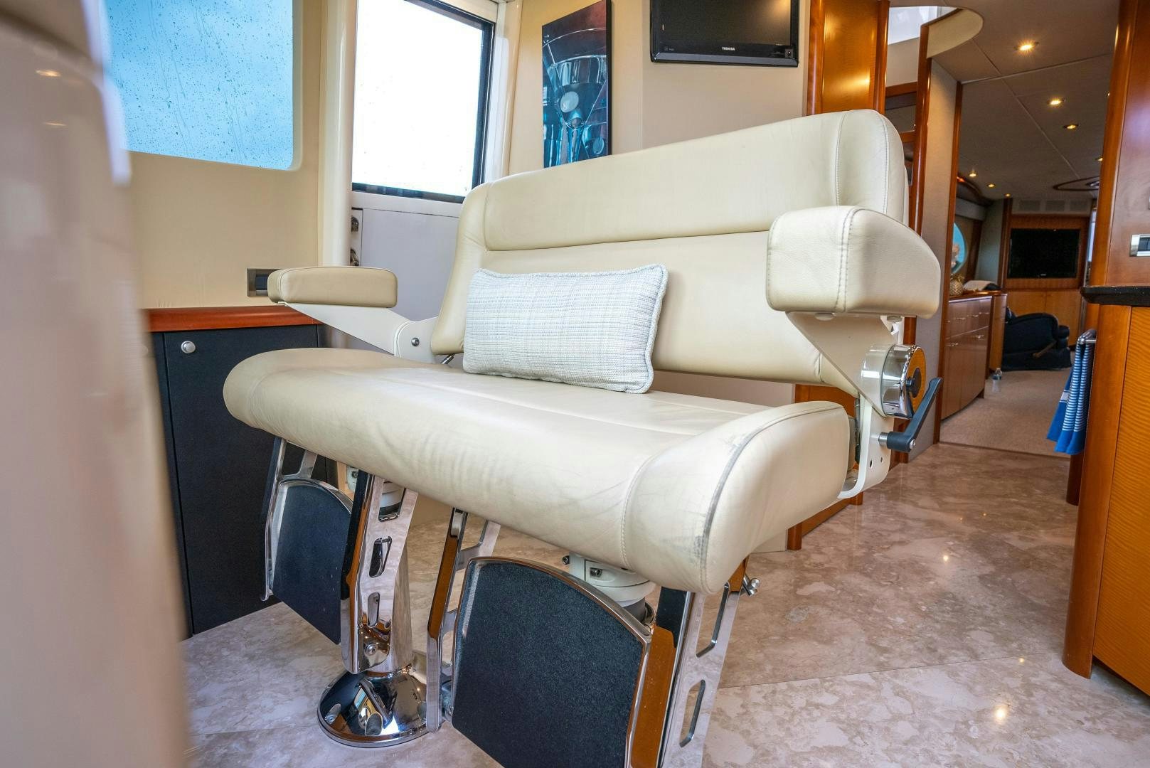 a white couch in a room aboard STARFIRE Yacht for Sale