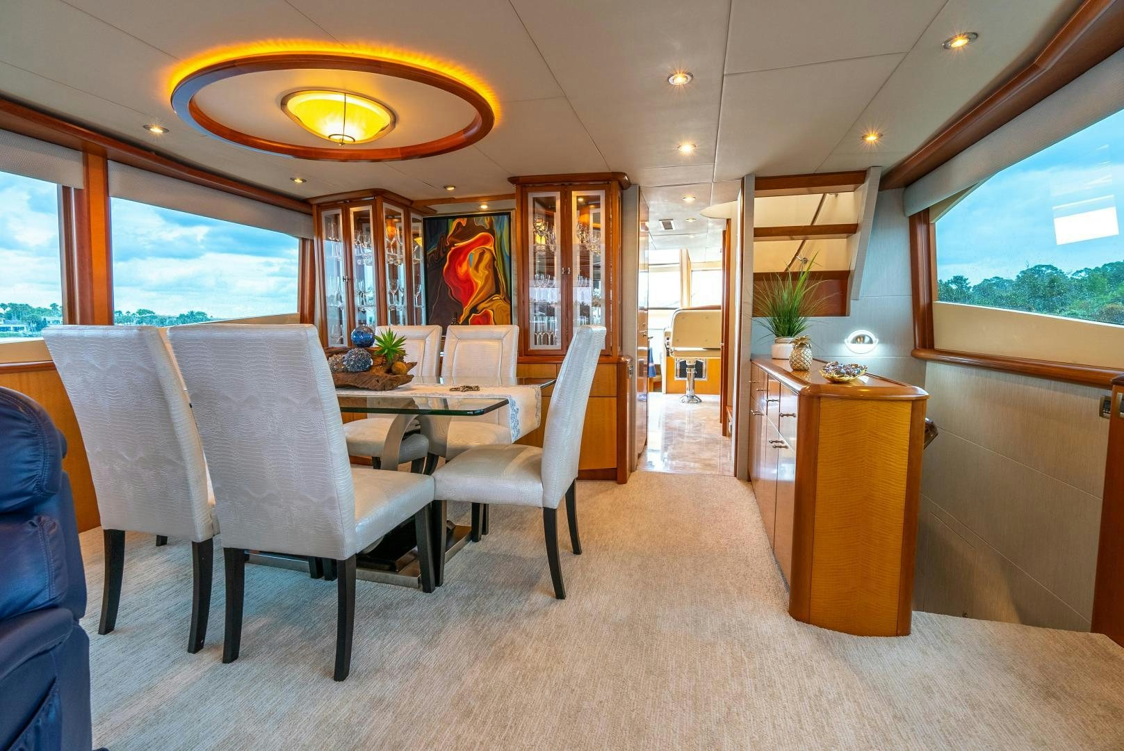a room with a table chairs and a window aboard STARFIRE Yacht for Sale