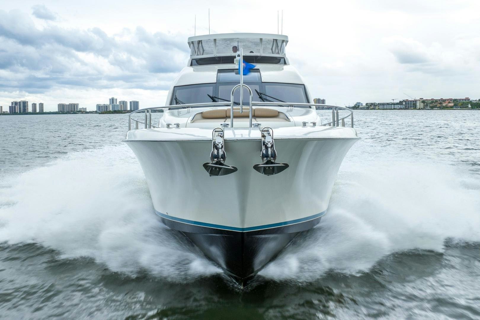 a white boat on water aboard STARFIRE Yacht for Sale