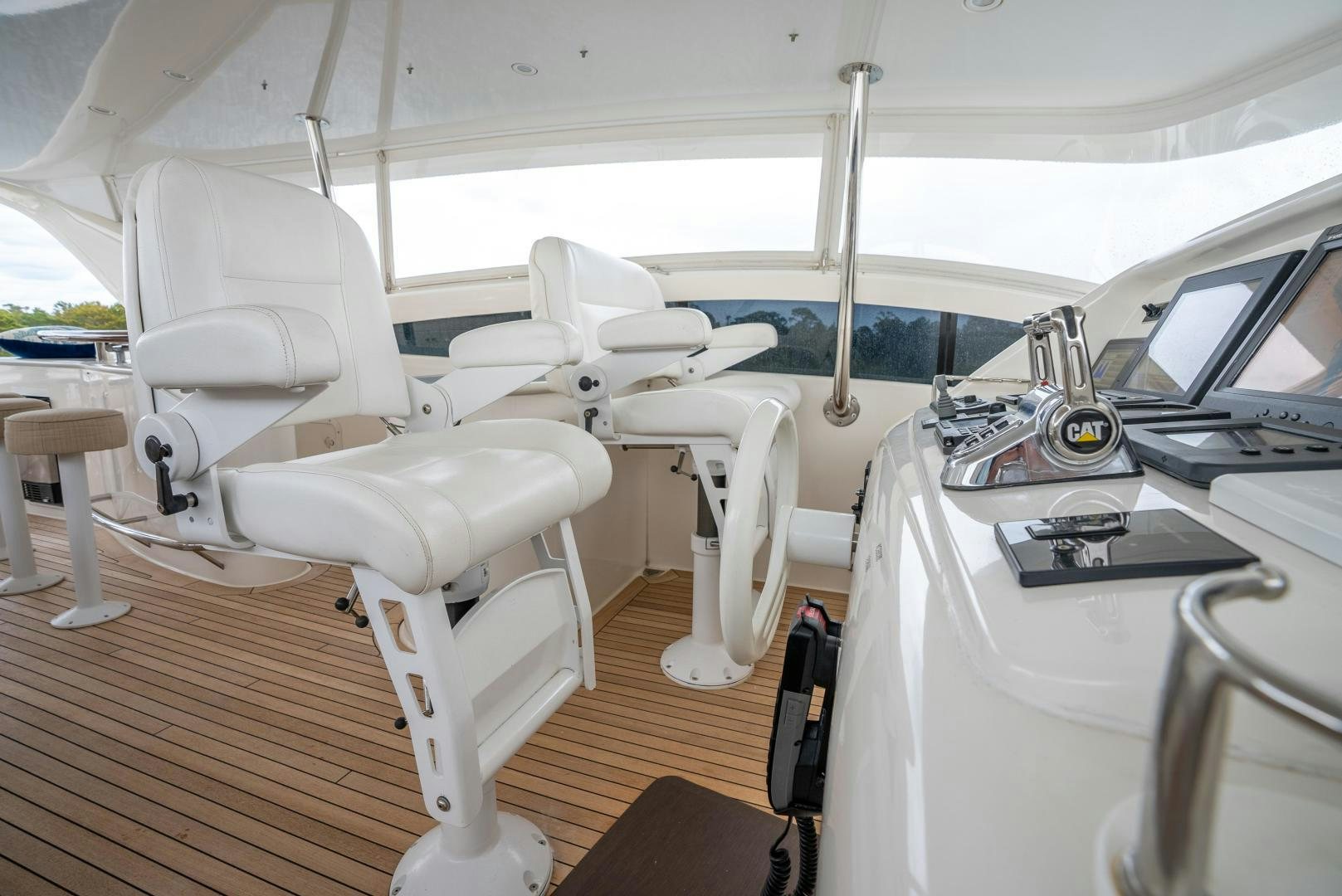 a white tent with a table and chairs aboard STARFIRE Yacht for Sale