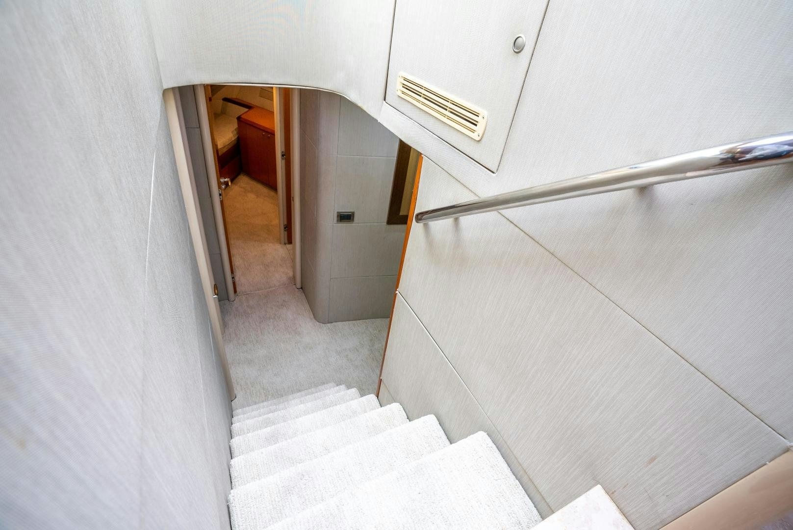 a hallway with white walls aboard STARFIRE Yacht for Sale