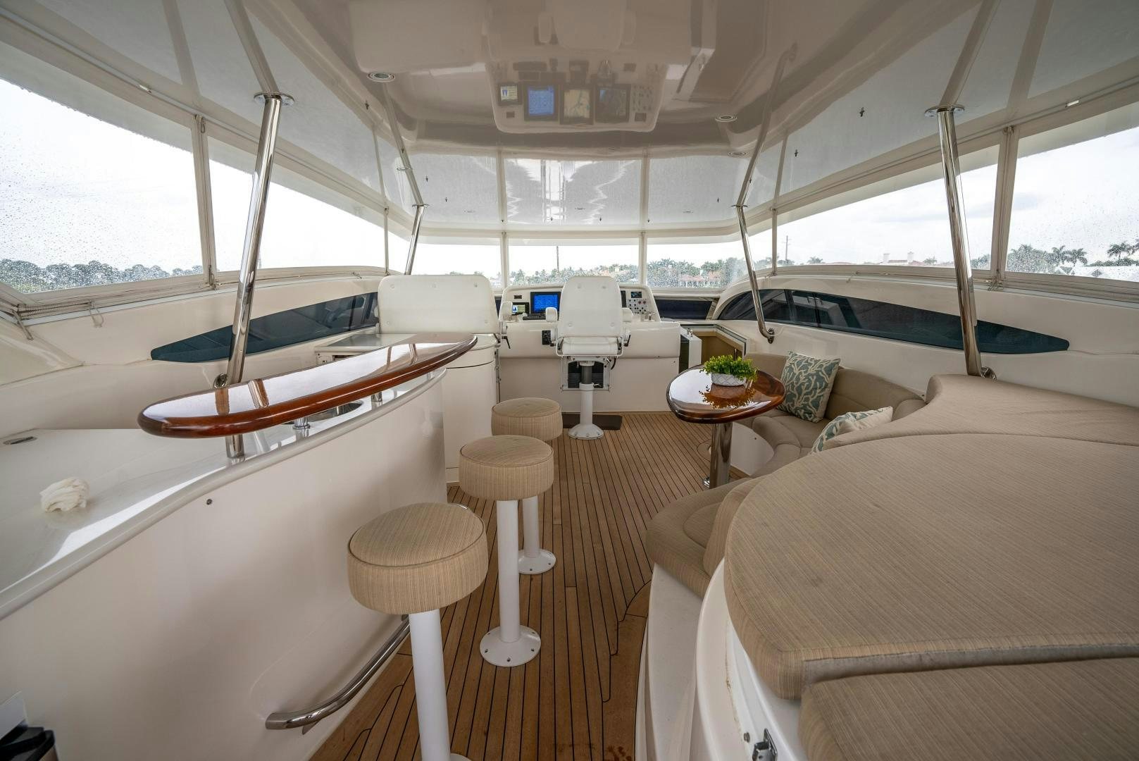 a boat with a table and chairs aboard STARFIRE Yacht for Sale