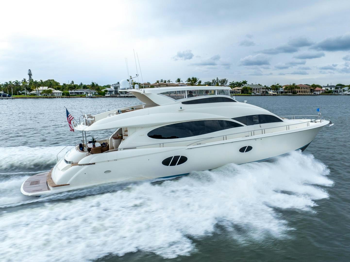 a white yacht on water aboard STARFIRE Yacht for Sale