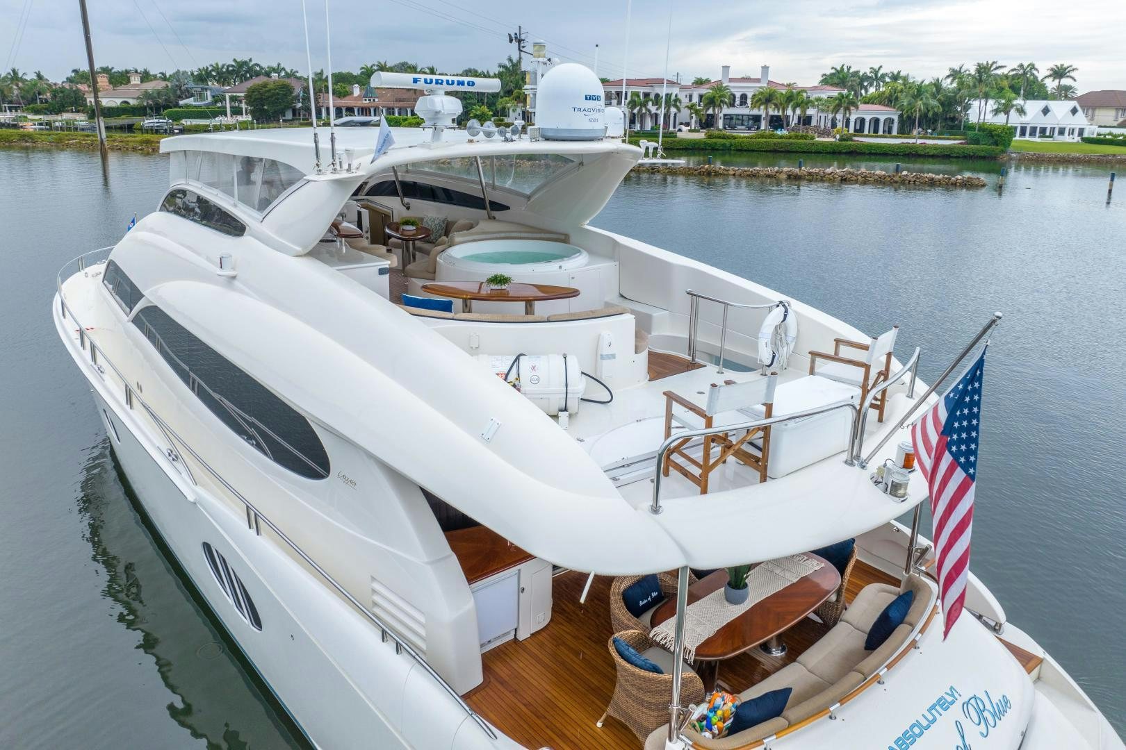 a boat with a flag on the deck aboard STARFIRE Yacht for Sale