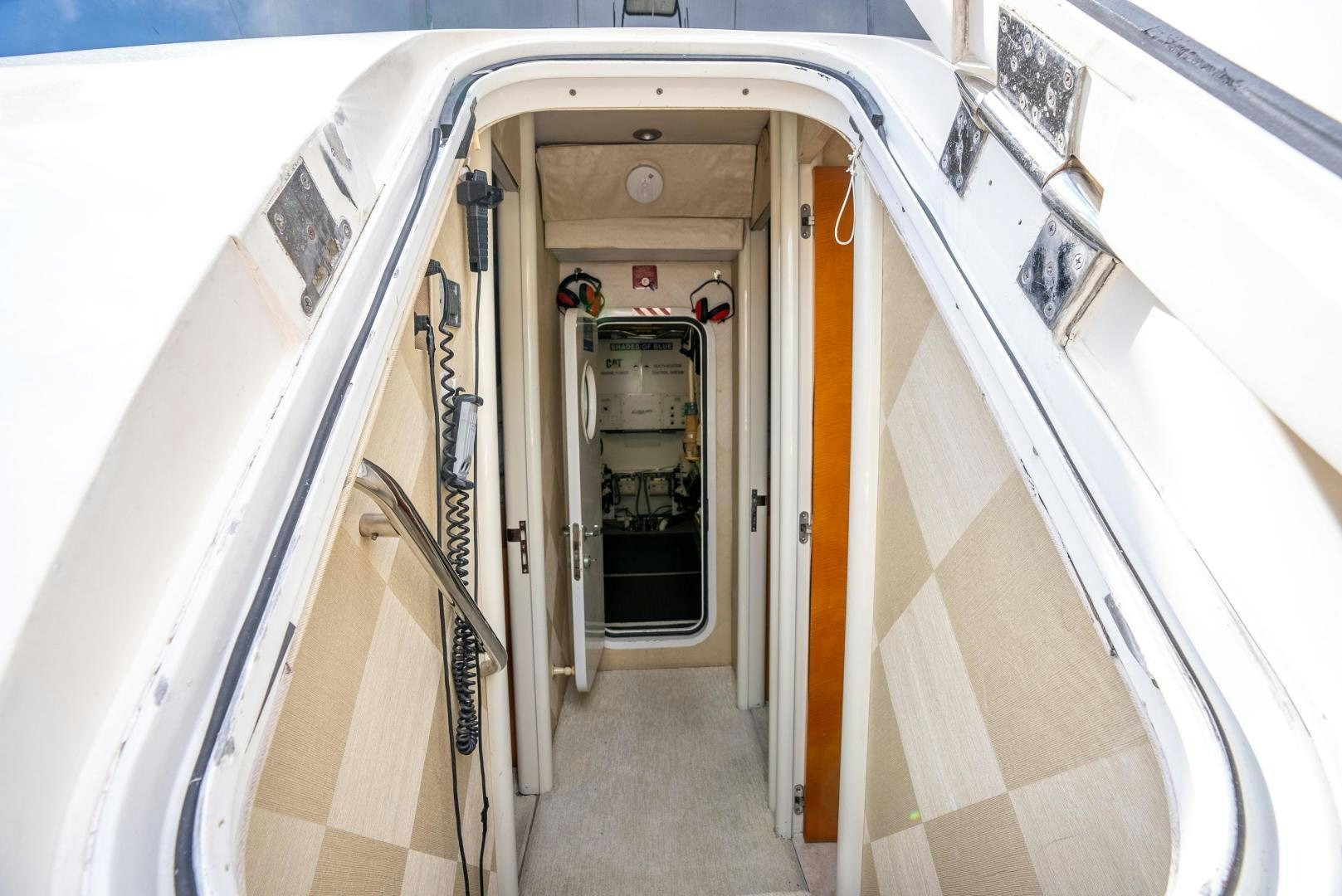 a hallway with doors aboard STARFIRE Yacht for Sale
